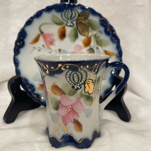 Hand painted cobalt blue and white Nippon demitasse cup and saucer.